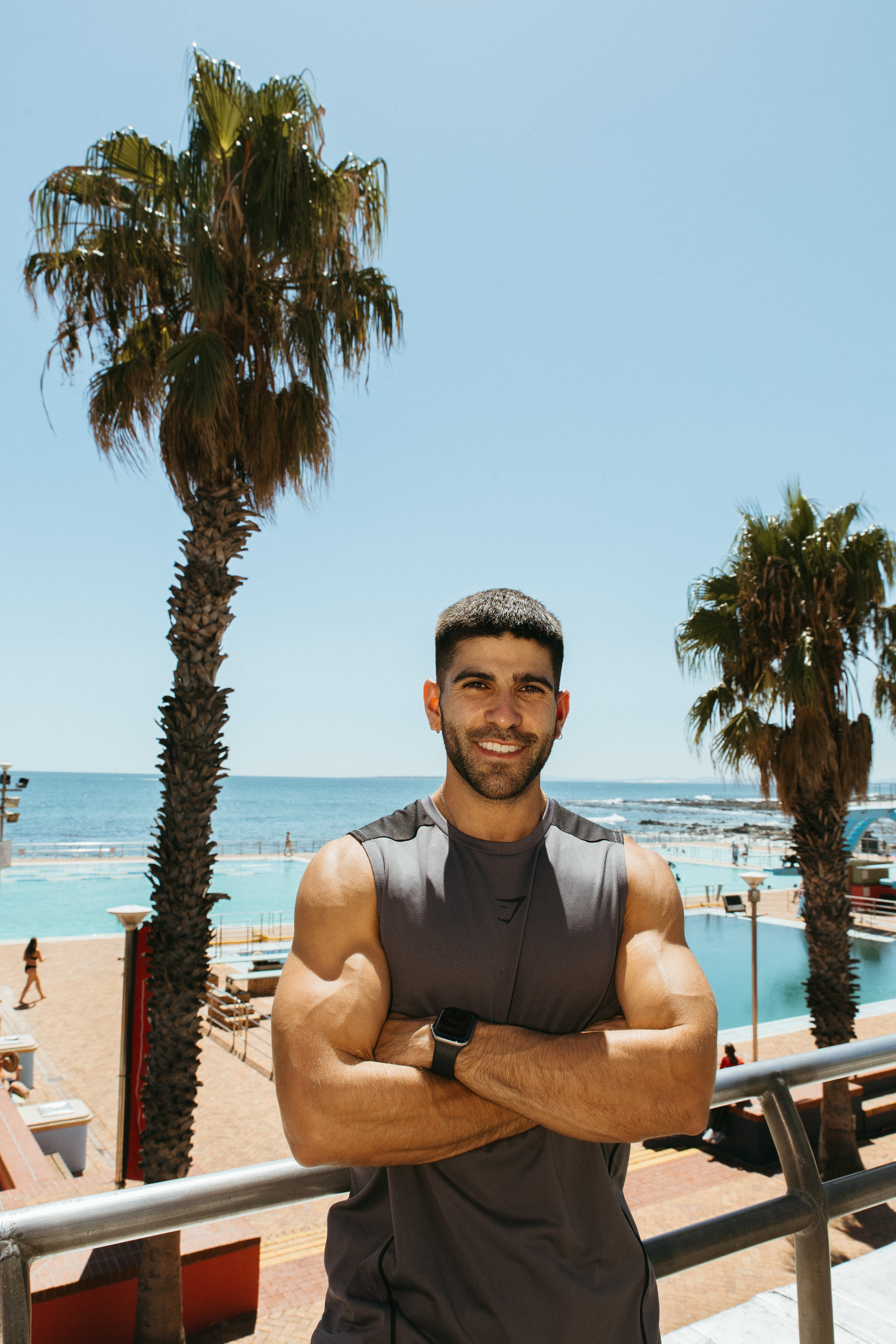 Joe stretching outdoors near the ocean